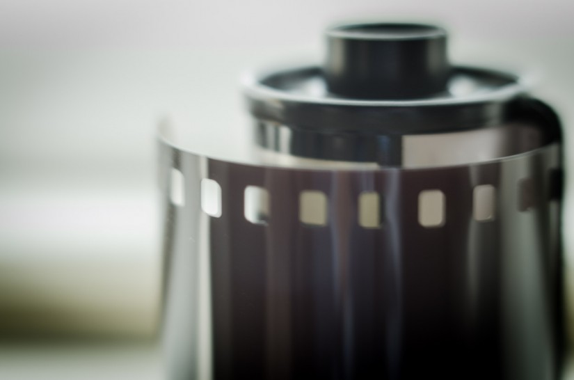 drawing his cape around his shoulders...